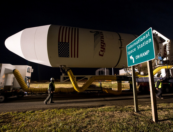 The Antares rocket carrying Orbital Sciences' first cargo-carrying Cygnus spacecraft rolls to its launch pad at NASA's Wallops Flight Facility on Wallops Island, Va. ahead of launch. Liftoff is set for Jan. 7.